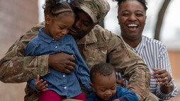 african american family embracing children and parents