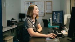 medical professional at computer